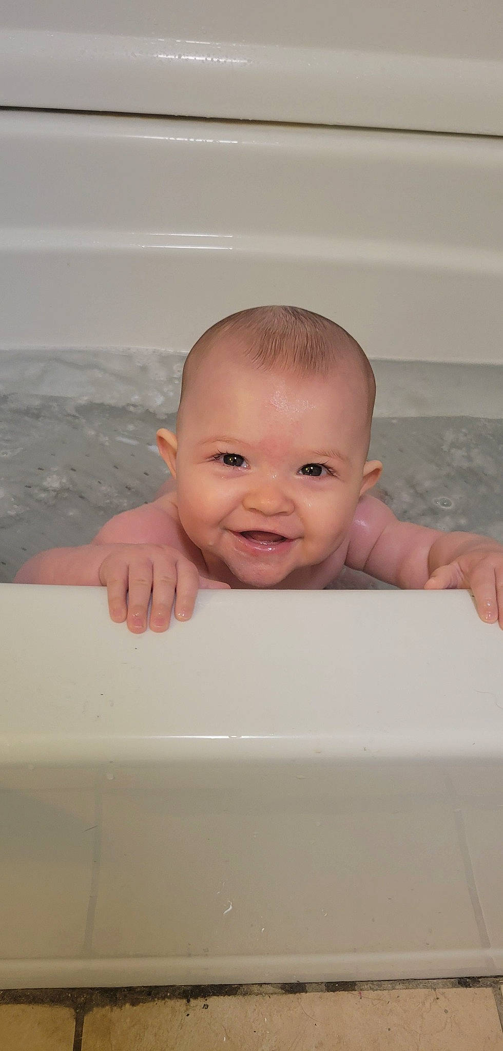 Madalynn joined the competition — help win amazing prizes! baby, baby_bathing, bathing, bathroom, bathtub, cheek, chest, child, eyebrow, eyelash, face, flooring, fluid, fun, happy, joy, person, plumbing_fixture, room, skin