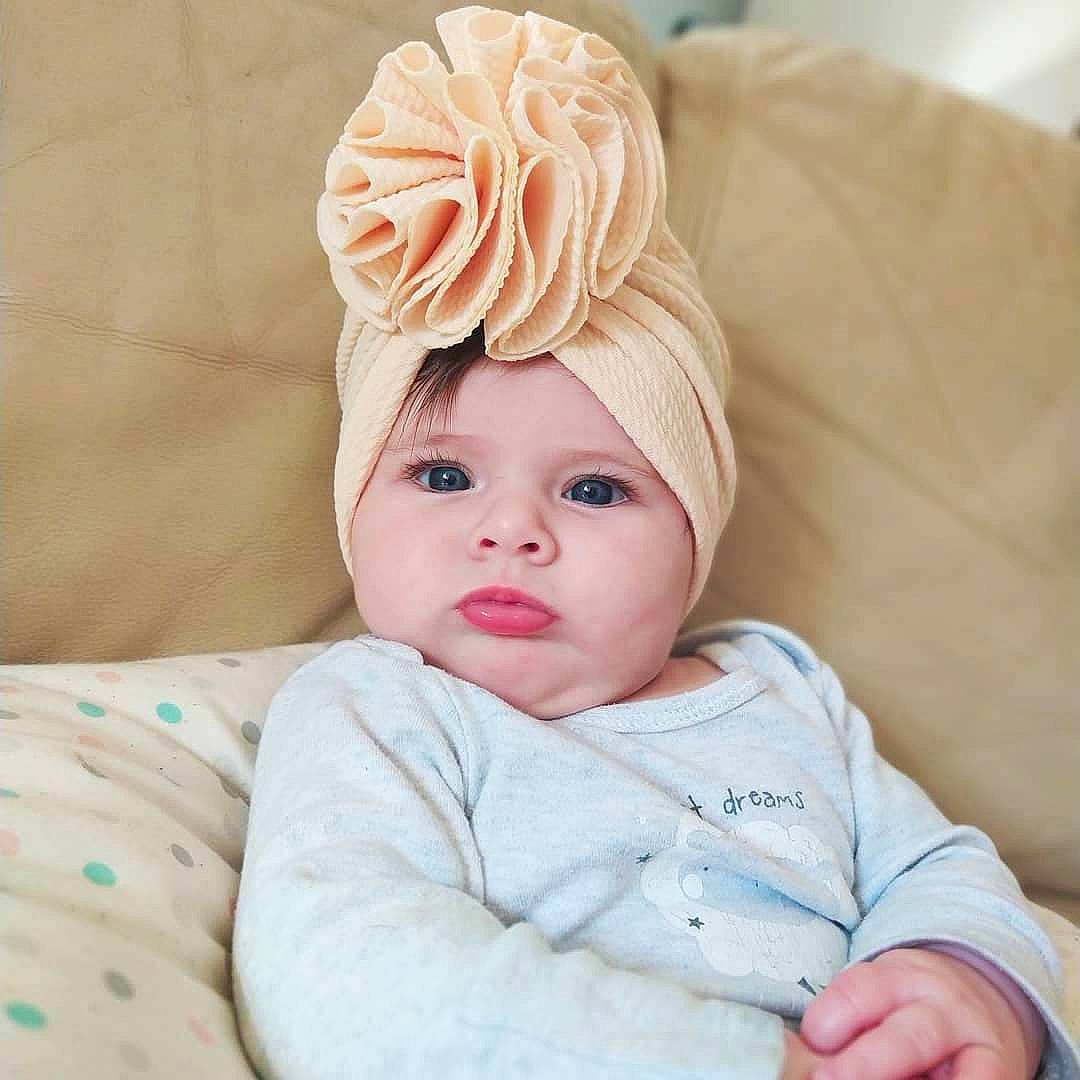 Myah a rejoint le concours — aidez-le/la à gagner de superbes lots ! baby, baby_sleeping, baby_toddler_clothing, cap, cheek, chin, comfort, eye, eyebrow, face, hat, head, headband, headpiece, headwear, linens, lip, person, petal, skin