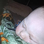 Cyrus is registered to the contest to win money with this photo: baby, sleeping, face, blanket, closeup, child, cozy, eyelashes, resting, soft_light, texture, pattern, comfort, peaceful, indoors, portrait, cute, nap, infant, relaxation