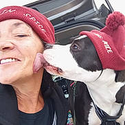 Mazy joined the competition — help win amazing prizes! affection, animal, black_and_white_dog, car, casual, close_up, clothing, dog, friendship, happy, hat, headwear, licking, outdoor, person, pet, red_hat, smiling, trunk, winter_hat