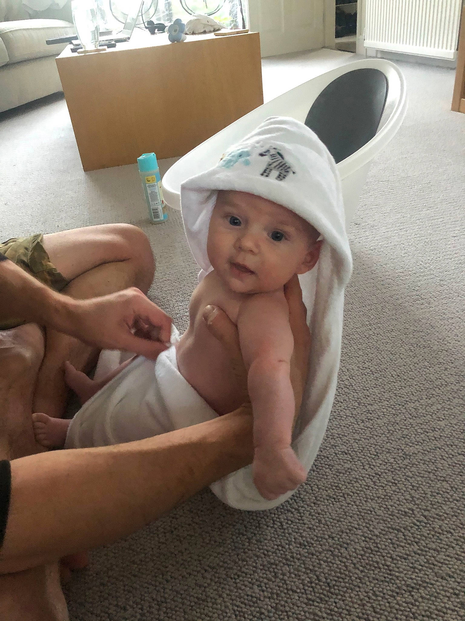 Alfred is registered to the contest to win money with this photo: baby, bathing, child, headgear, headwear, leg, person