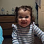 Saige joined the competition — help win amazing prizes! bedroom, carpet, casual_clothing, child, curly_hair, cute, dresser, furniture, happy, indoor, person, playing, portrait, smiling, striped_shirt, tablet, technology, toddler, water_bottle, young_child