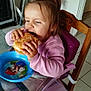 élyna participe au concours pour gagner de l'argent avec cette photo : burger, casual, child, eating, face, food, furniture, glass_table, hand, happy, high_chair, indoor, kitchen, mario, meal, person, pink_sweater, plate, seat, toddler