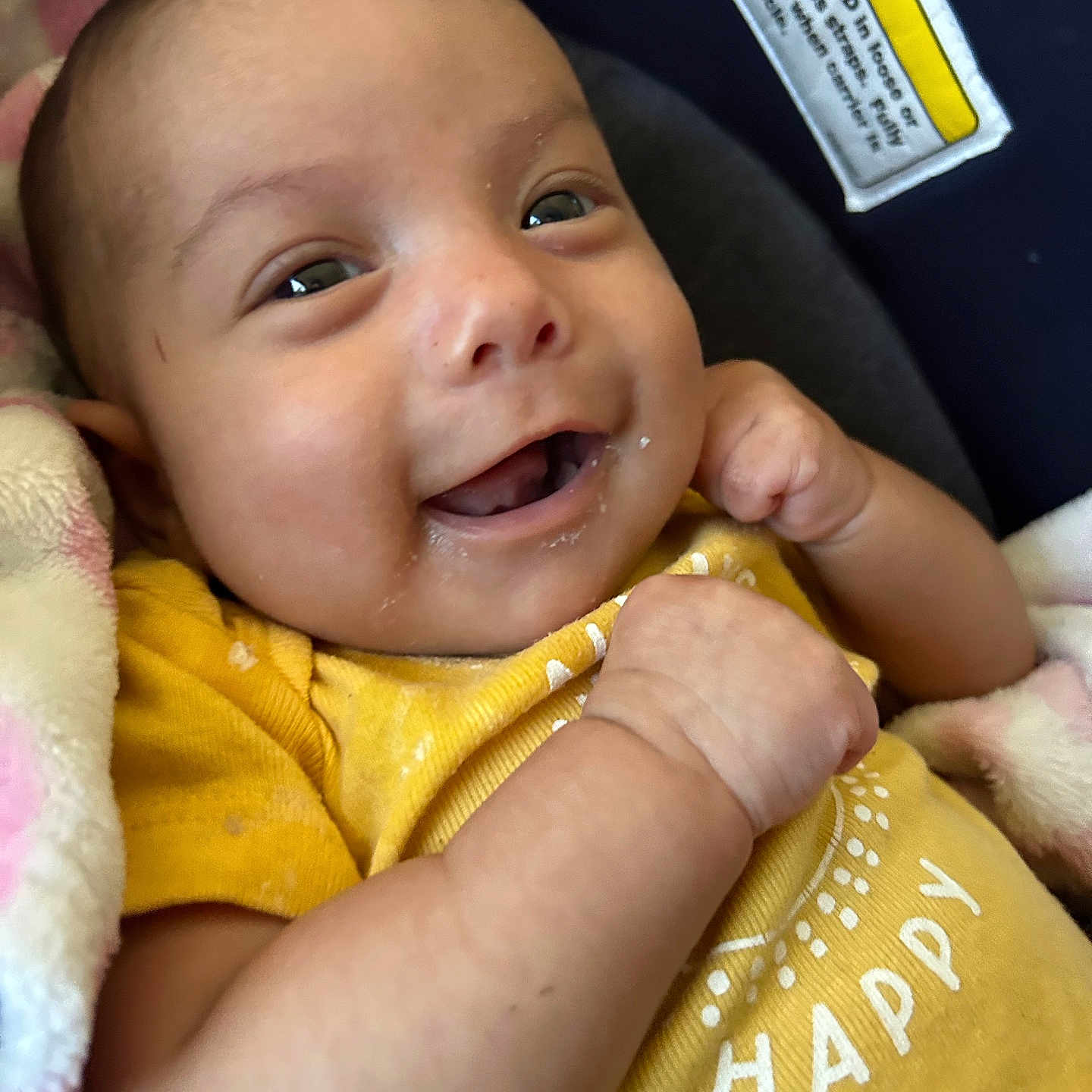 Aliana joined the competition — help win amazing prizes! baby, blanket, child, closeup, clothing, cute, expression, face, fist, happy, indoors, infant, joyful, newborn, person, skin, smiling, soft_texture, warning_label, yellow_shirt