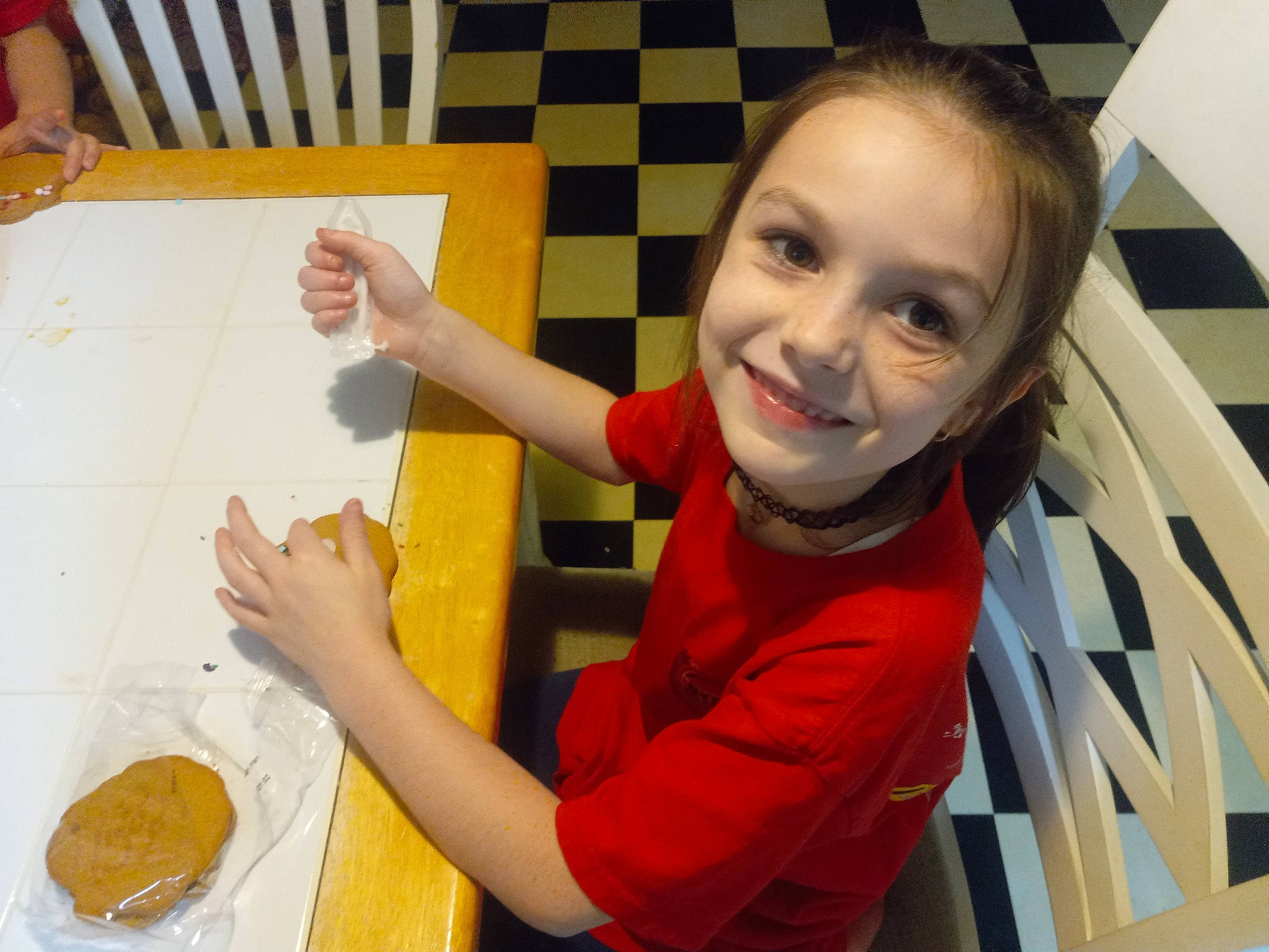 Breelyn joined the competition — help win amazing prizes! chair, child, cooking, finger, flooring, food, fun, hand, joy, leisure, orange, person, plate, smile, t_shirt, table, tableware, thumb, toddler, wood
