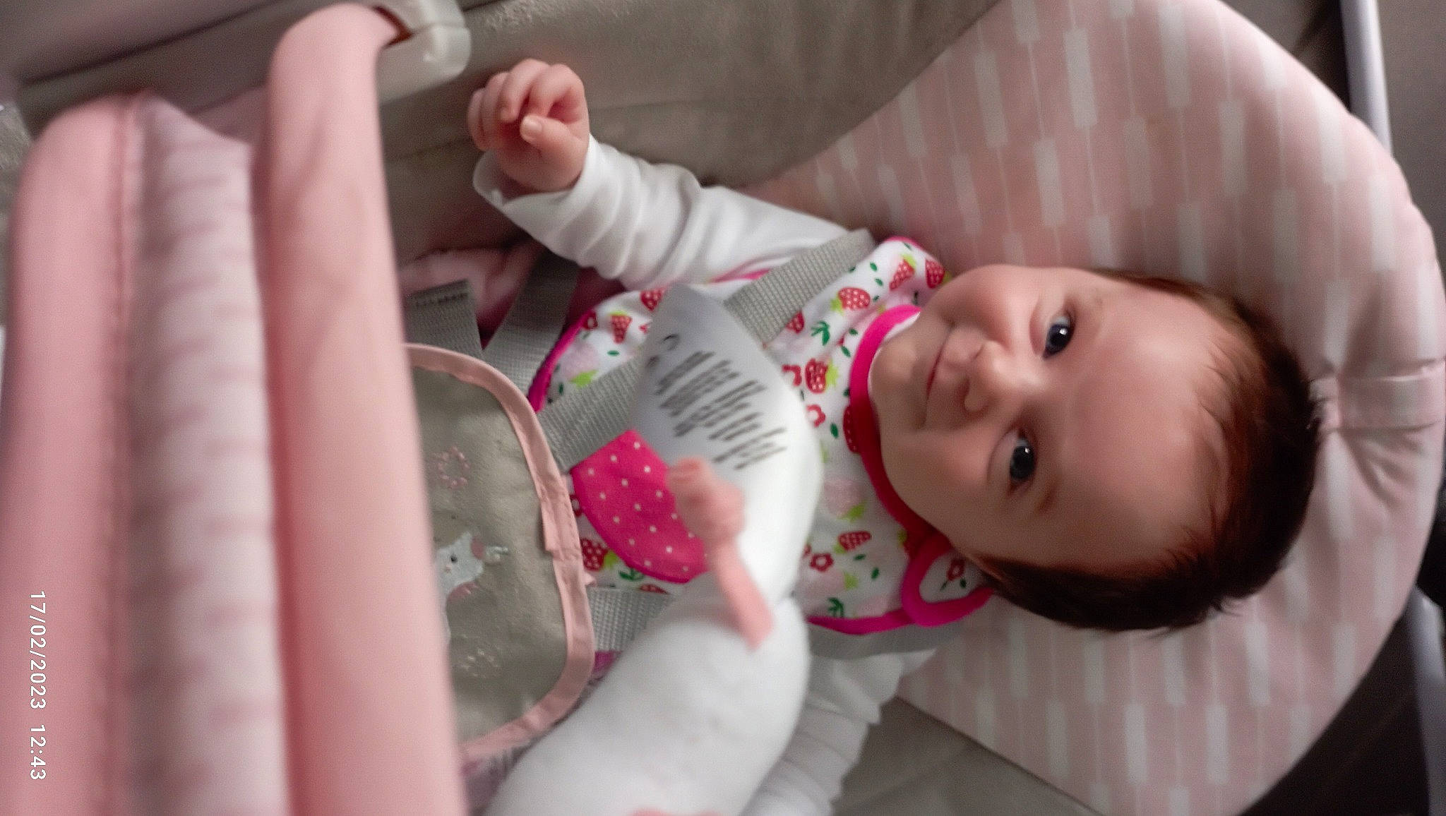 Lya participe au concours pour gagner de l'argent avec cette photo : baby, baby_products, baby_safety, baby_toddler_clothing, cheek, child, comfort, dress, eyelash, happy, lip, mouth, nose, person, pink, room, skin, sleeve, smile, textile