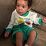 Milo joined the competition — help win amazing prizes! brown_leather, casual, child, clothing, comfortable, couch, curly_hair, cute, expression, face, green_shorts, indoor, person, portrait, sesame_street, sitting, sweatshirt, toddler, white_socks, young_child