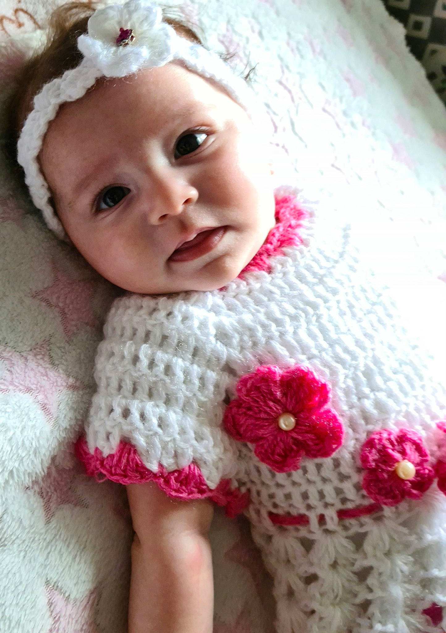 Aliyah participe au concours pour gagner de l'argent avec cette photo : baby, baby_toddler_clothing, cheek, dress, eye, eyebrow, eyelash, face, flower, head, headgear, headwear, iris, lip, organ, outerwear, person, pink, skin, sleeve