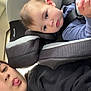 Octavia joined the competition — help win amazing prizes! child, baby, car_seat, seat_belt, person, young_child, car_interior, hoodie, black_clothing, playful, tongue_out, silly_face, hair, earrings, seat, window, daylight, face, portrait, casual