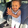 Jayciona joined the competition — help win amazing prizes! black_leather, car_interior, car_seat, child, clapping, cute, daylight, hair_clips, happy, jewelry, person, pink, playful, seat, smiling, sunlight, tank_top, toddler, white_pants, window
