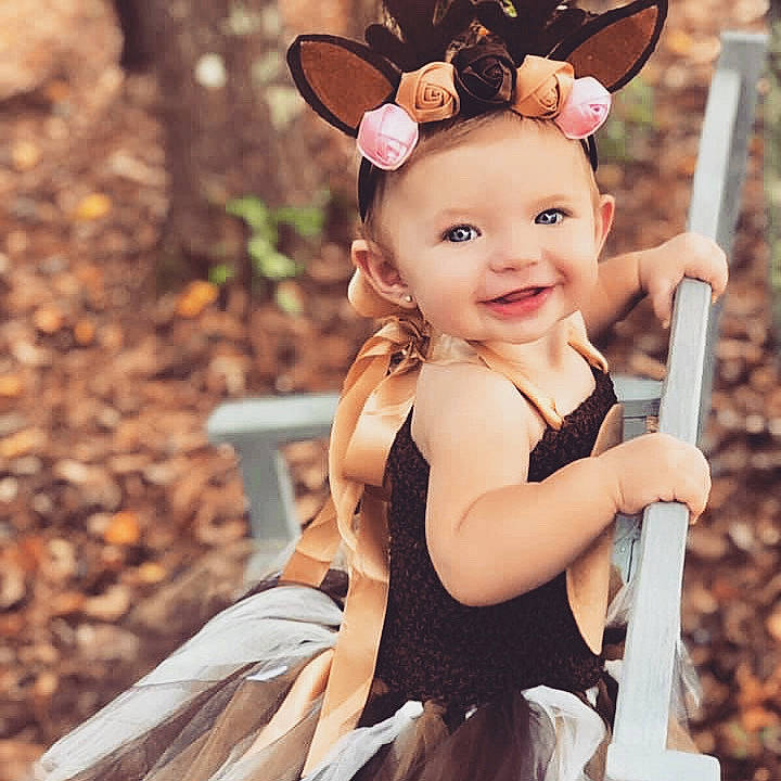 Blakelee is registered to the contest to win money with this photo: antler, beauty, child, child_model, costume, dress, ear, eye, face, fawn, hairstyle, happy, head, headgear, joy, organ, person, photo_shoot, product, skin