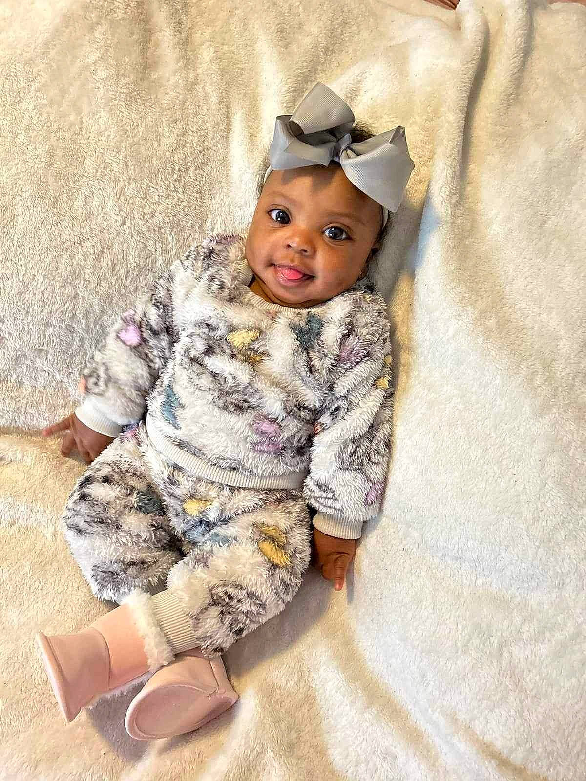 Adrianna joined the competition — help win amazing prizes! baby, baby_toddler_clothing, camouflage, cap, child, clothing, comfort, eye, flooring, fur, happy, headwear, hood, linens, military_camouflage, outerwear, pattern, person, sitting, sleeve