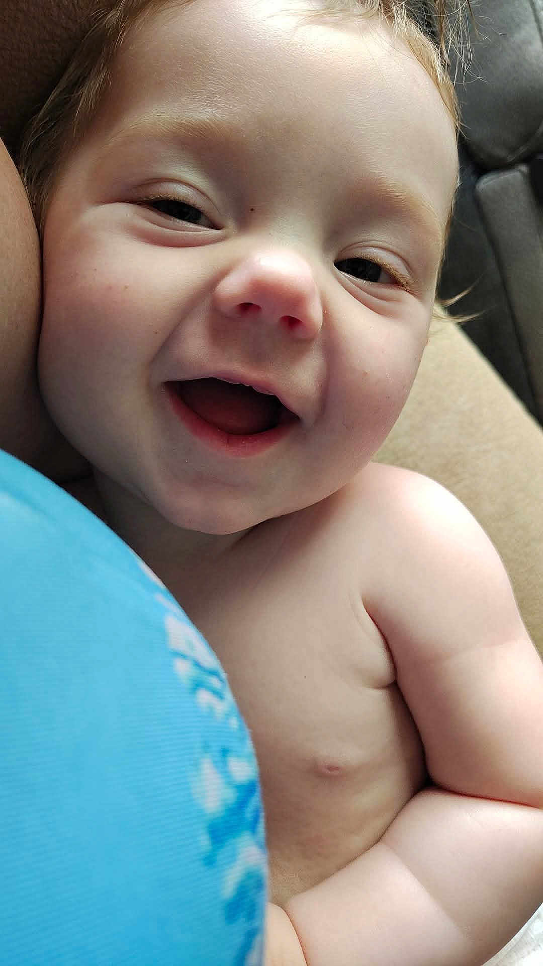Sunnie joined the competition — help win amazing prizes! baby, child, smiling, happy, face, skin, closeup, portrait, infant, bare_shoulders, cuddle, joy, expression, cute, natural_light, human, baby_skin, cheeks, mouth_open, relaxation