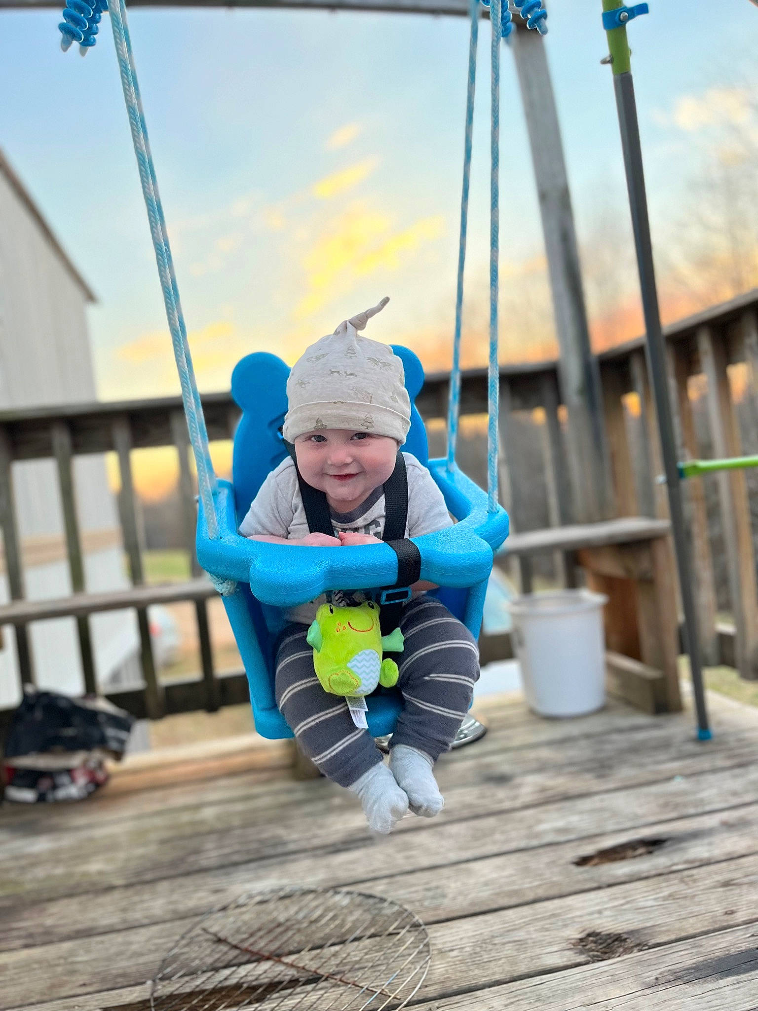 Eli joined the competition — help win amazing prizes! baby, baby_toddler_clothing, child, clothing, cloud, electric_blue, fun, happy, hat, headwear, jacket, joy, leisure, person, recreation, rope, sitting, sky, smile, swing