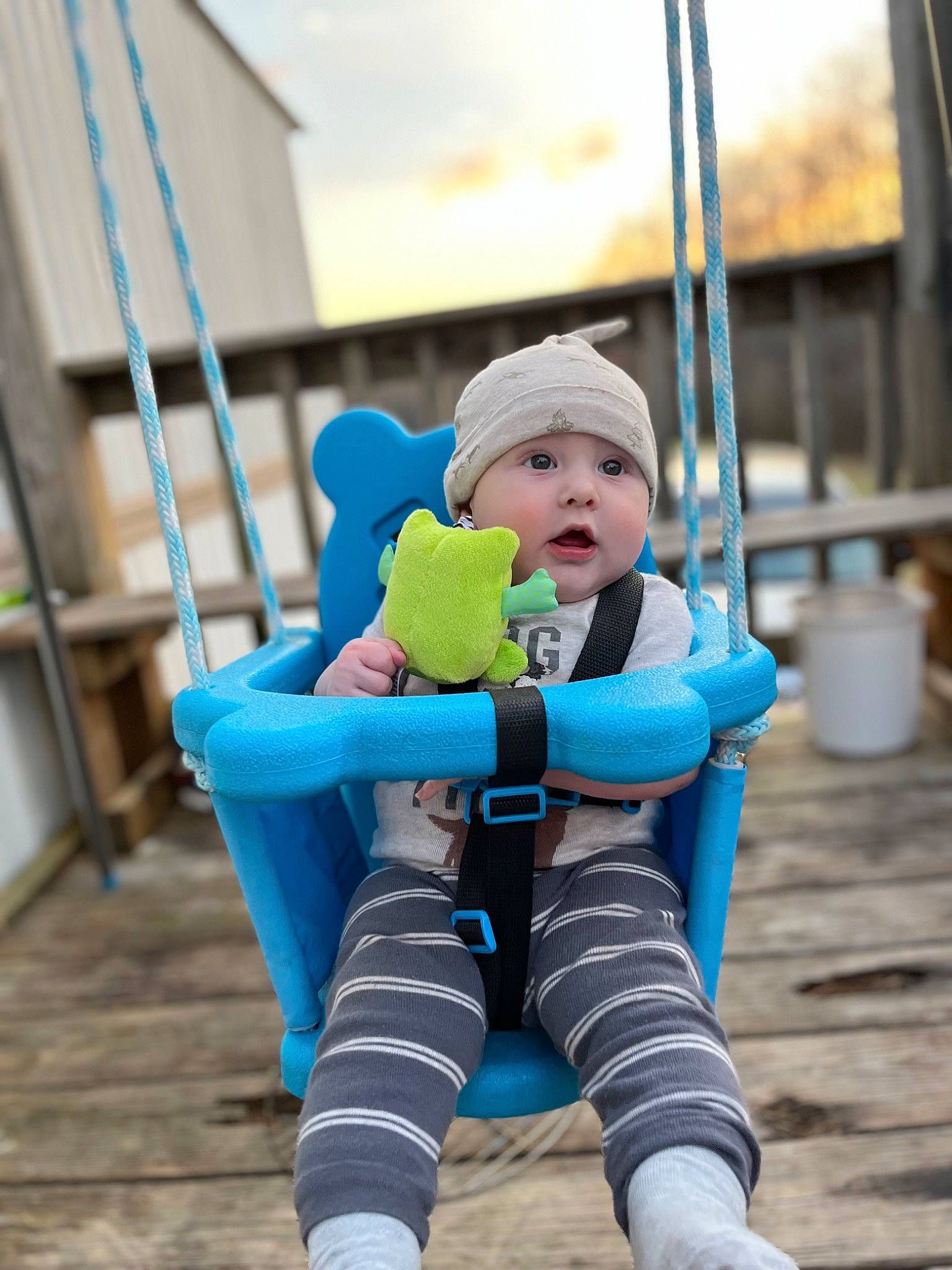 Eli joined the competition — help win amazing prizes! baby, baby_toddler_clothing, child, city, electric_blue, fun, happy, headwear, jacket, jeans, leg, leisure, outdoor_play_equipment, person, playground, recreation, shoe, sitting, sock, surprise