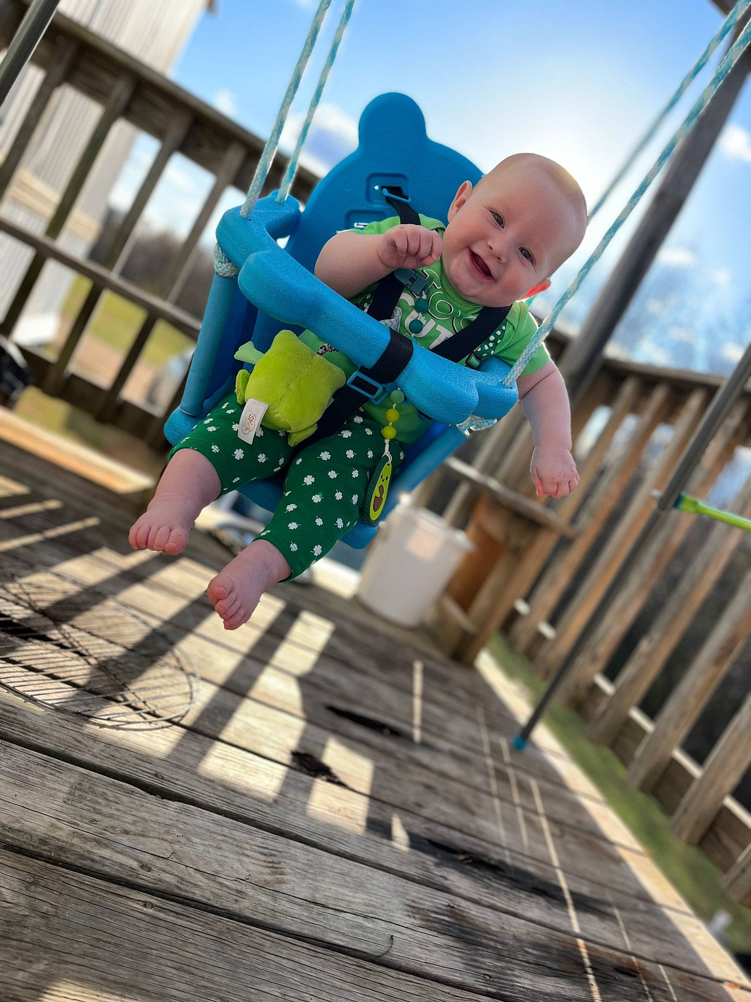 Eli joined the competition — help win amazing prizes! child, city, electric_blue, fun, happy, joy, leisure, nonbuilding_structure, outdoor_play_equipment, people_in_nature, person, play, playground, recreation, rope, shorts, sky, smile, swing, toddler