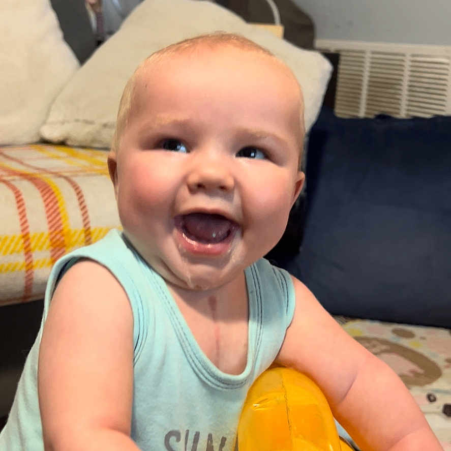Bentley joined the competition — help win amazing prizes! baby, babylaughing, banana, bodypart, couch, face, finger, food, fruit, furniture, hand, happy, head, laughing, person, photography, plant, portrait, produce, smile