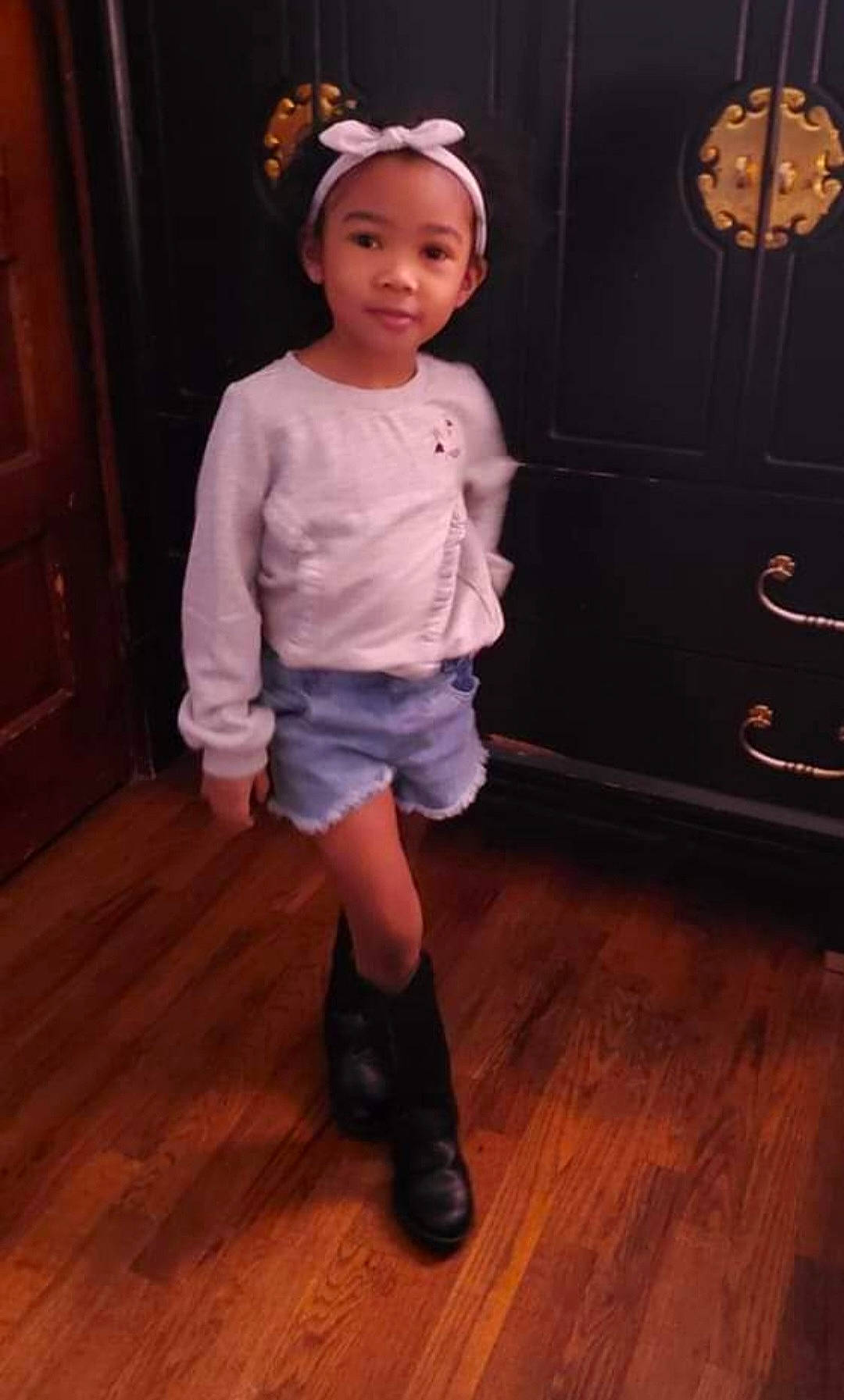 Brianna is registered to the contest to win money with this photo: baby_toddler_clothing, cabinetry, door, drawer, face, fashion_accessory, fashion_design, floor, flooring, happy, hardwood, head, headwear, joy, laminate_flooring, person, sleeve, smile, toddler, varnish