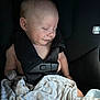 baby, sleeping, car_seat, blanket, child, infant, peaceful, smiling, face, seatbelt, safety, cute, portrait, closeup, resting, indoors, soft_light, comfort, toddler, childcare
