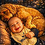 Jacob is registered to the contest to win money with this photo: baby, dog, smiling, bib, cozy, indoor, warm_lighting, festive, snowfall, couch, fur, cute, happy, child, pet, portrait, toddler, comfort, friendship, holiday