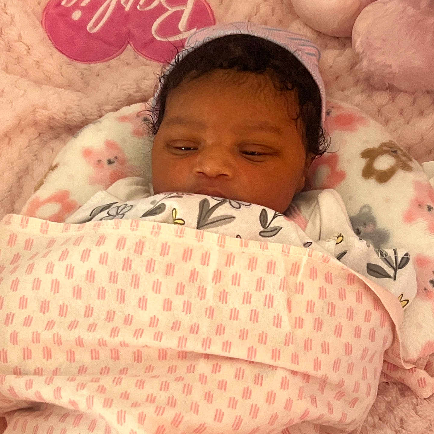 Ka Lani is registered to the contest to win money with this photo: baby, newborn, blanket, pink, soft, plush, heart, pillow, sleeping, child, infant, cute, cozy, bed, headwear, face, resting, comfort, warm, person