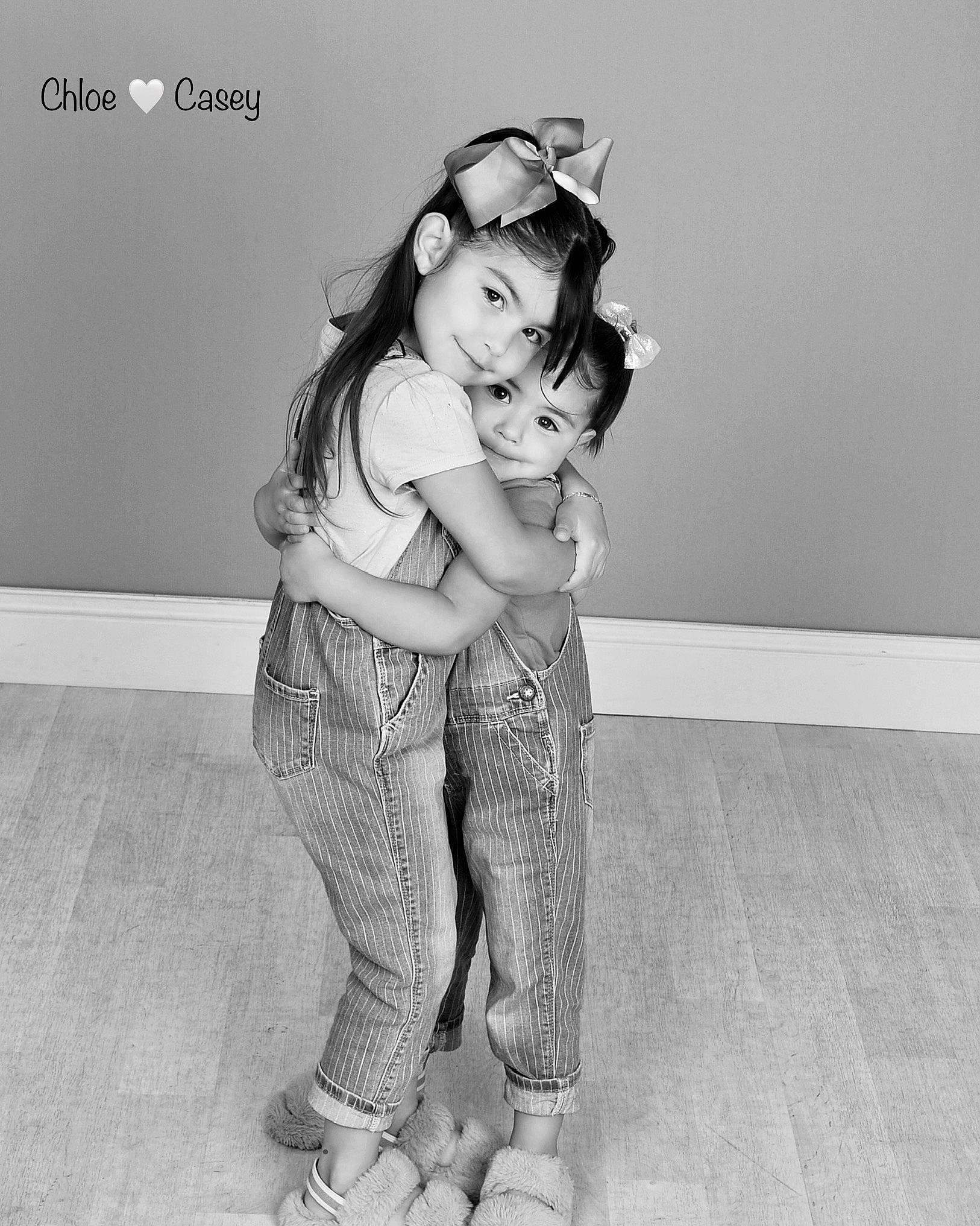 Chloe joined the competition — help win amazing prizes! abdomen, elbow, face, fashion_design, flash_photography, gesture, happy, human_leg, joy, knee, leg, monochrome, monochrome_photography, person, sandal, sitting, smile, style, thigh, toddler