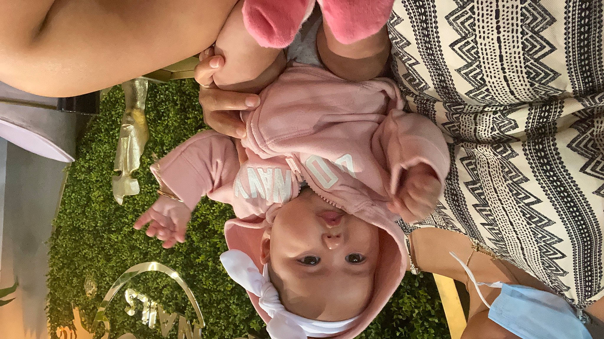 Celine is registered to the contest to win money with this photo: baby, child, cuisine, dish, finger, flesh, food, fun, gesture, grass, happy, headwear, ingredient, leaf_vegetable, mouth, nail, peach, person, pink, sunglasses