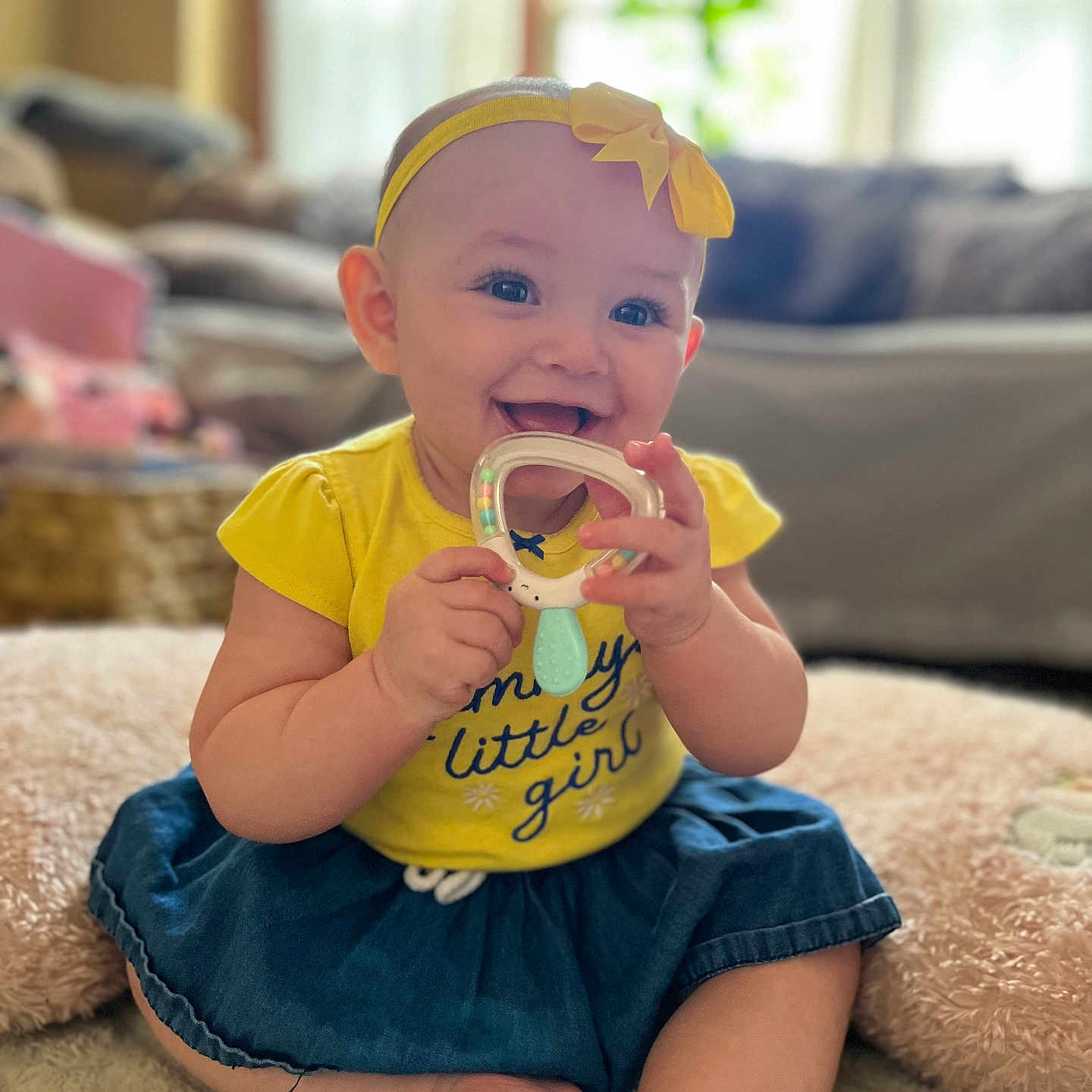 Mackenzie is registered to the contest to win money with this photo: architecture, baby, bodypart, building, clothing, couch, cutlery, face, finger, furniture, hand, head, indoors, livingroom, person, photography, portrait, room, sitting, spoon