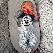 Theodore joined the competition — help win amazing prizes! baby, baby_lounger, child, clothing, cozy, cute, gray_shirt, indoor, infant, mickey_mouse, newborn, outfit, peaceful, plush_blanket, portrait, resting, sleeping, small_hands, soft_texture, white_pants