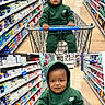 toddler, child, shopping_cart, green_hoodie, nike, store_aisle, supermarket, personal_care_products, toothpaste, shelves, floor, shopping, baby, portrait, person, clothing, handrail, grocery, cute, indoors