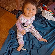 Serenity joined the competition — help win amazing prizes! baby, child, infant, sitting, smiling, portrait, indoors, blanket, blue_blanket, pink_clothing, polka_dots, cartoon_print, minnie_mouse, barefoot, brown_hair, blue_eyes, toys, wooden_floor, living_room, happy