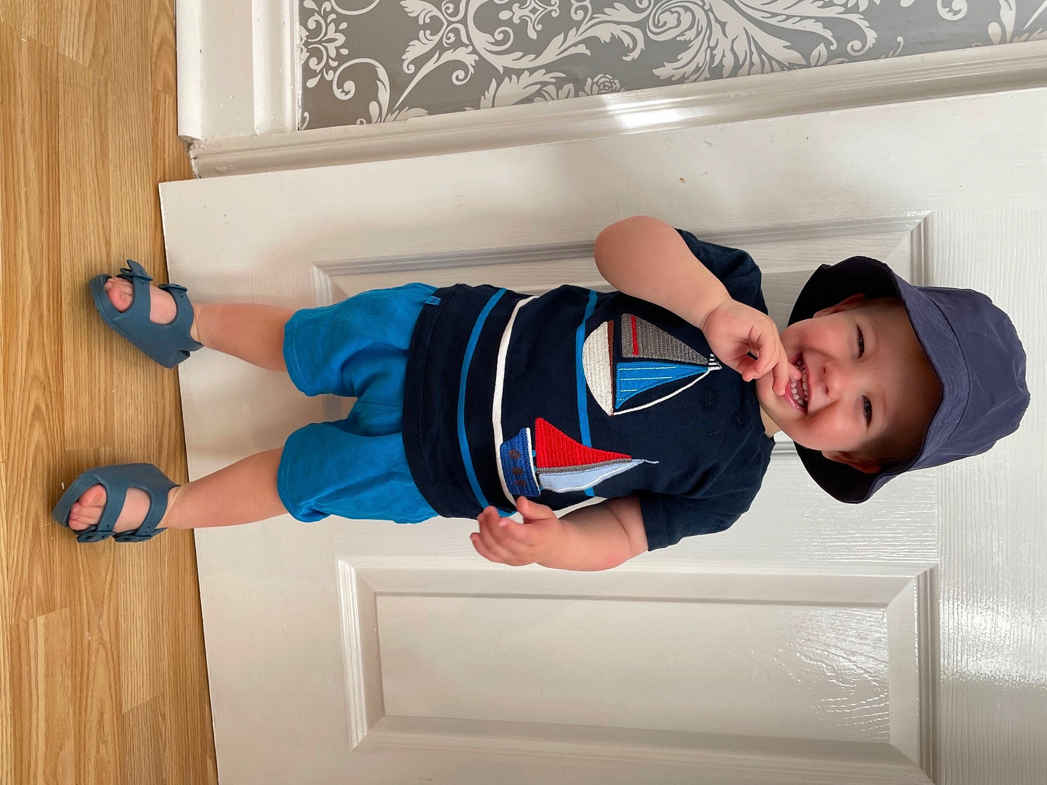 Kaysen joined the competition — help win amazing prizes! baby_toddler_clothing, child, comfort, electric_blue, fun, happy, hat, headwear, human_body, joy, knee, leg, person, room, shoe, sleeve, smile, sock, t_shirt, thigh