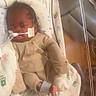 Teangelo is registered to the contest to win money with this photo: baby, bed, blanket, clothing, crib, cute, foot, handprint, healthcare, hospital, indoors, infant, medical_tubes, monitoring_wires, newborn, patient, person, resting, sleeping, swaddled