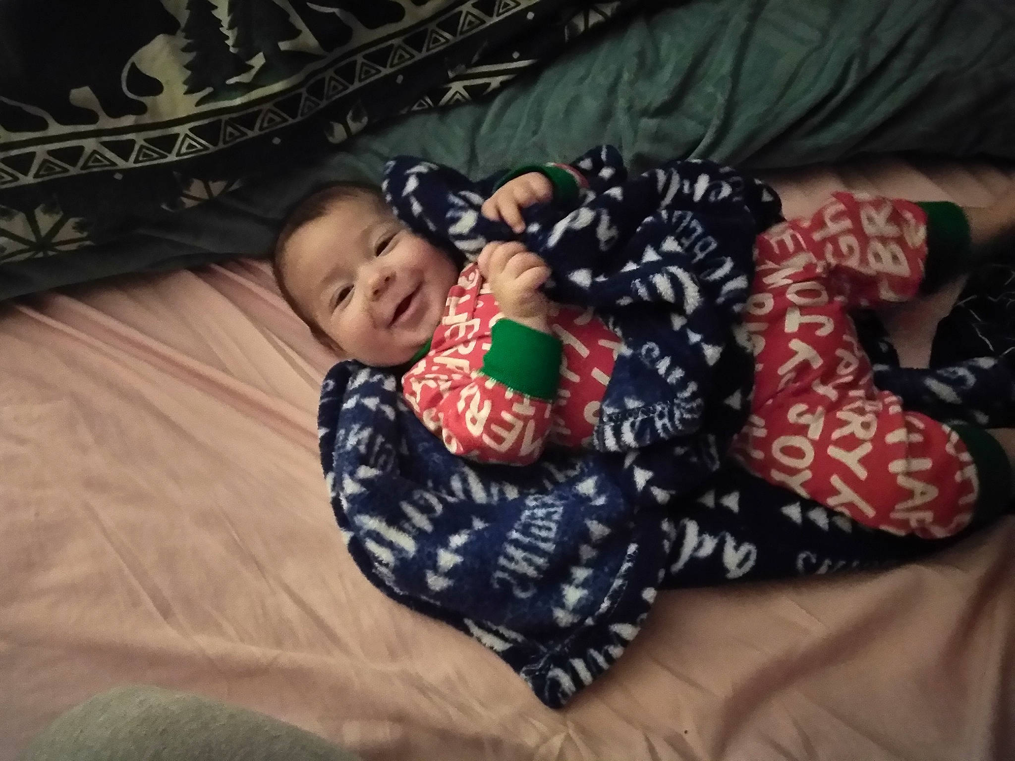 Leland is registered to the contest to win money with this photo: arm, black, child, day, design, fashion_accessory, finger, fun, girl, infant, joy, material, organ, pattern, person, play, product, sitting, skin, smile