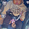 baby, infant, child, stroller, portrait, sitting, wide_eyed, bow, pacifier, baby_clothing, sweatshirt, boots, heart_filter, digital_filter, car_seat, harness, beads, outdoor, photography, cute