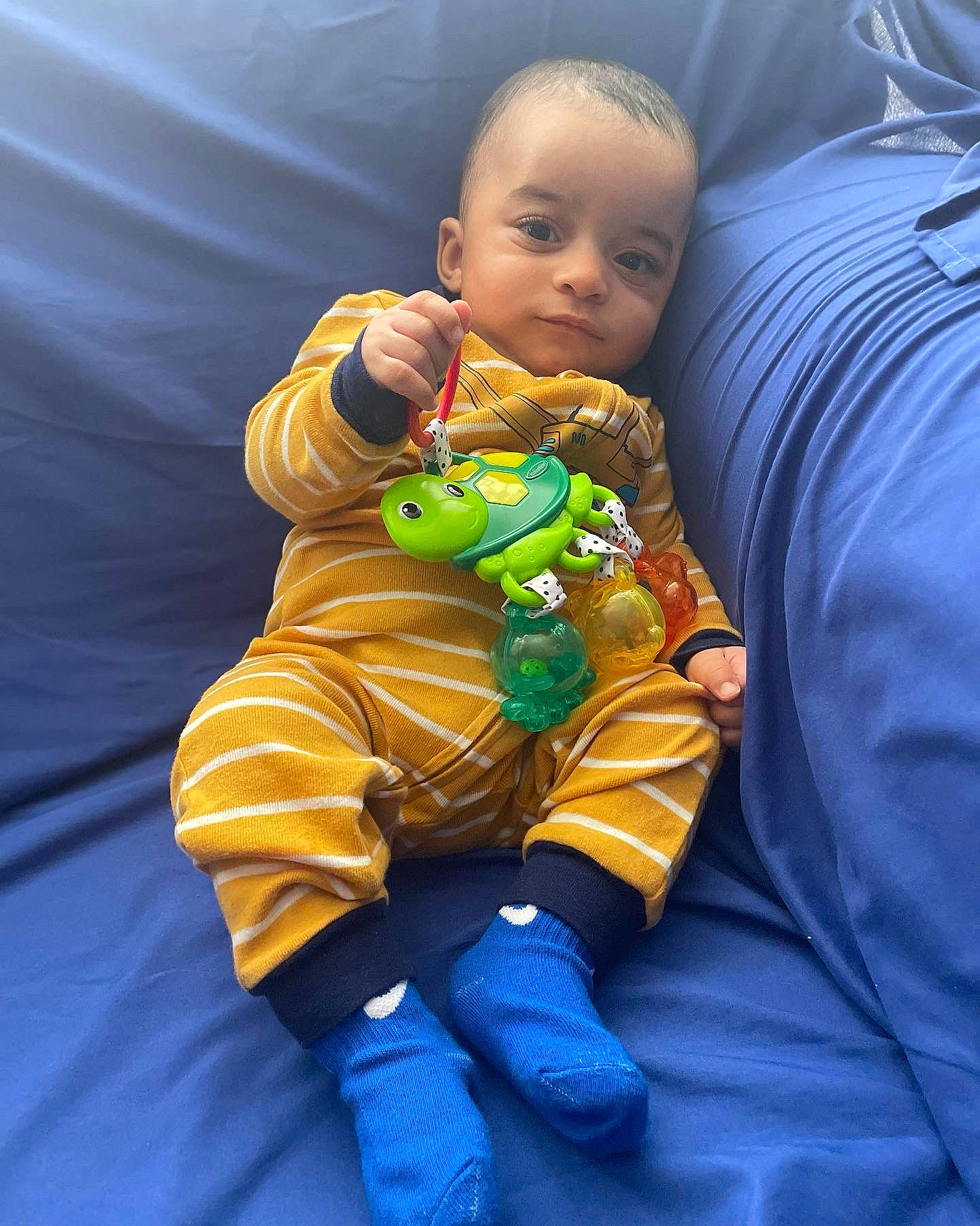 Cairo joined the competition — help win amazing prizes! baby, baby_toddler_clothing, cheek, child, comfort, electric_blue, eye, face, finger, happy, head, mouth, nose, orange, person, purple, sleeve, stuffed_toy, textile, toddler