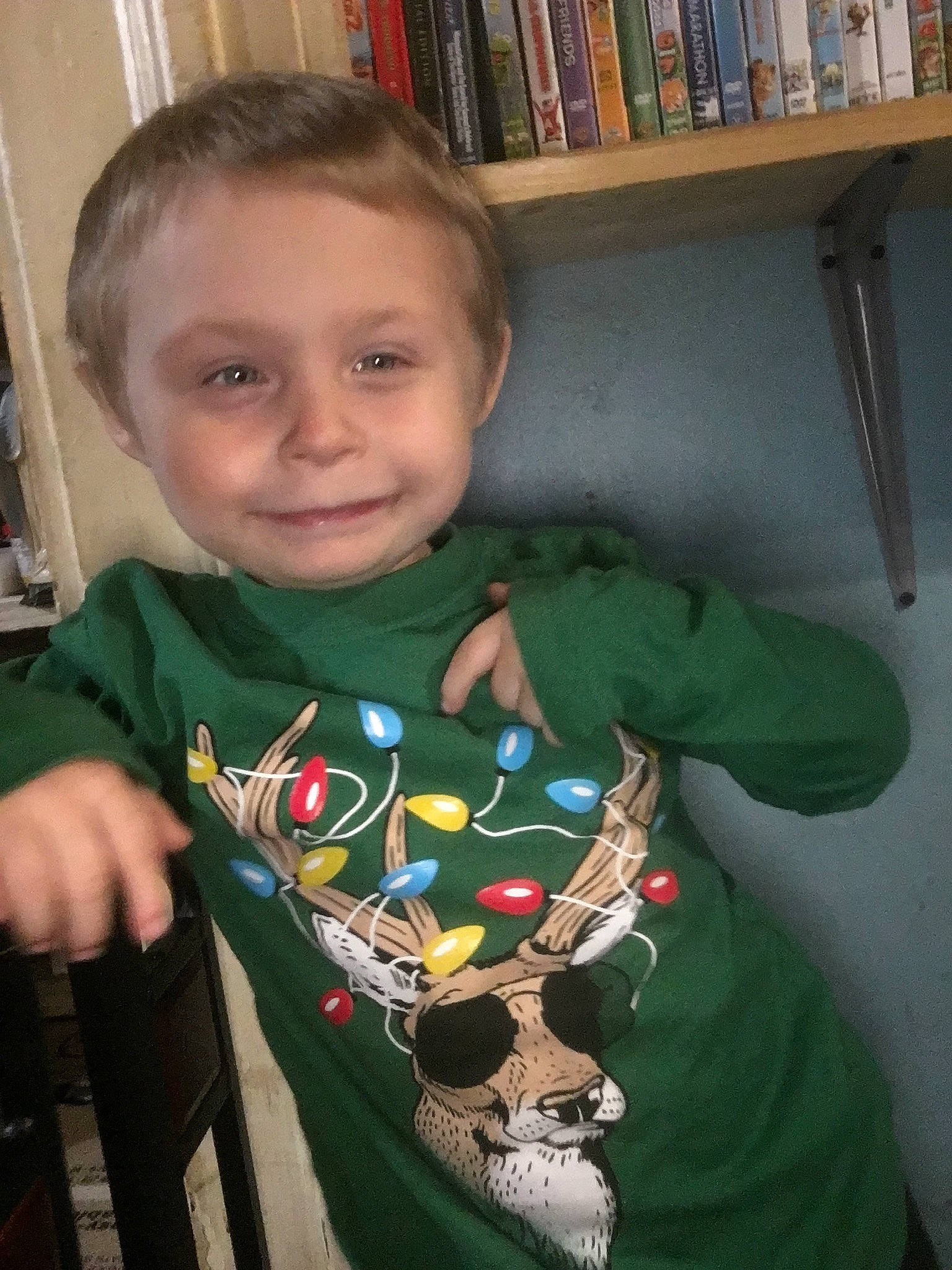 Jacob joined the competition — help win amazing prizes! baby_toddler_clothing, bookcase, chair, cheek, child, chin, elbow, eye, happy, holiday, iris, joy, neck, person, room, shelf, shelving, sitting, sleeve, smile