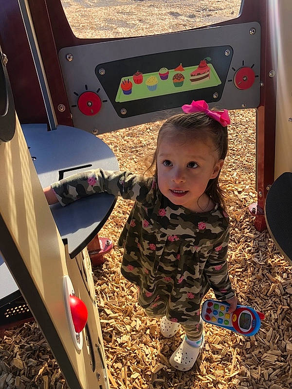 Emelia is registered to the contest to win money with this photo: automotive_exterior, baby, baby_toddler_clothing, bumper, child, city, family_car, fun, grass, leisure, motor_vehicle, person, play, recreation, soil, toddler, trunk, vehicle_door