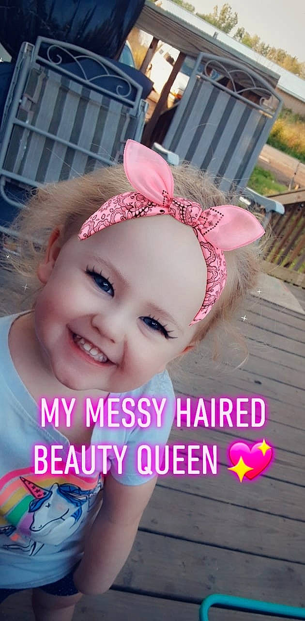 Harley is registered to the contest to win money with this photo: child, ear, fashion_accessory, hair_accessory, happy, headband, headgear, headwear, joy, person, photo_caption, pink, smile, toddler