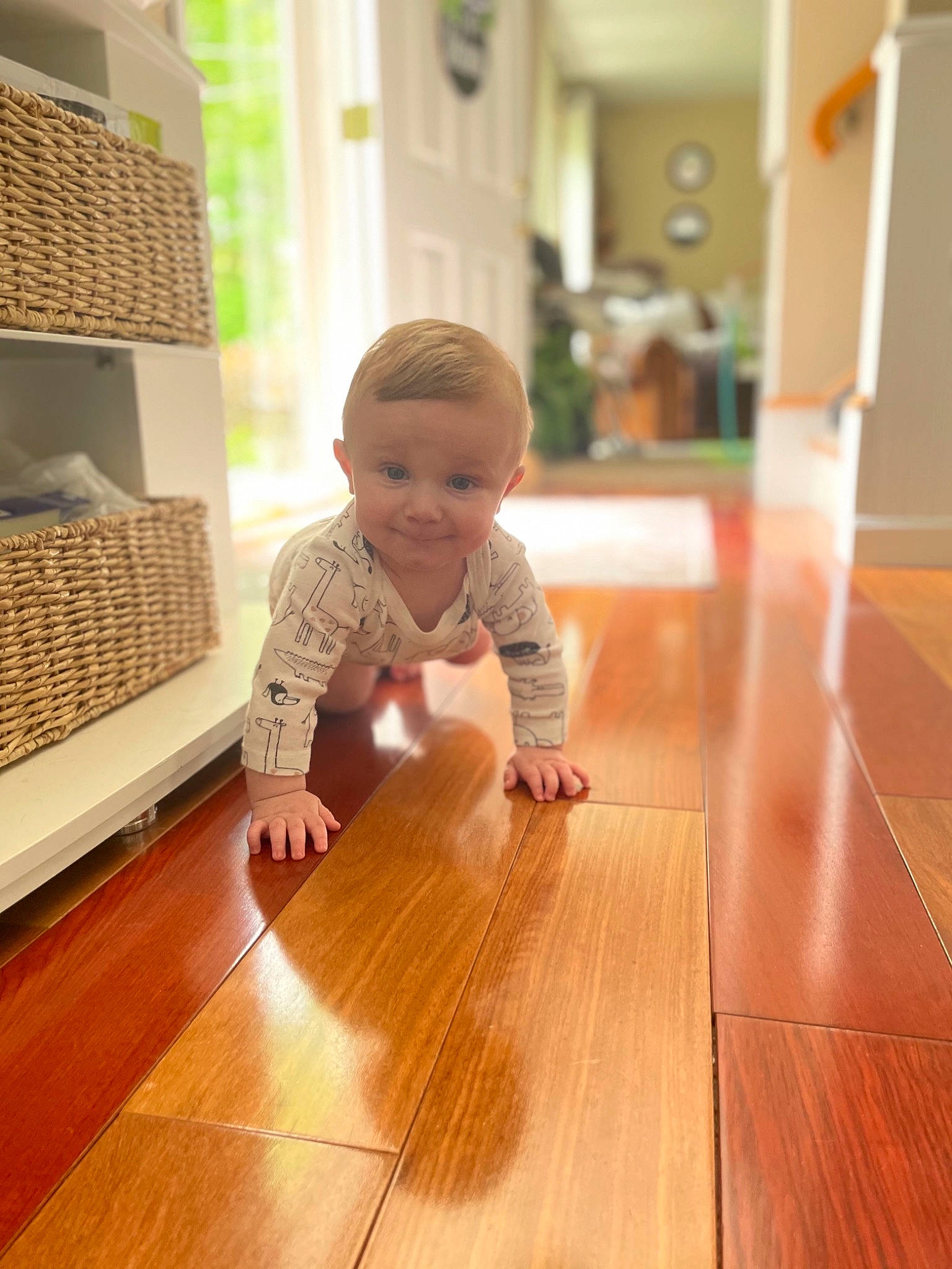 Colin is registered to the contest to win money with this photo: baby, baby_toddler_clothing, child, crawling, finger, floor, flooring, fun, hardwood, house, joy, laminate_flooring, pattern, person, plank, skin, table, toddler, varnish, wood