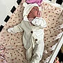Ellanor Rose joined the competition — help win amazing prizes! baby, infant, crib, pacifier, white_clothing, knit_hoodie, mittens, floral_pattern, pink, sleeping, cute, soft_texture, newborn, child, blanket, footwear, cozy, resting, indoors, person