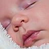 baby, sleeping, close_up, face, skin, lips, blanket, soft, peaceful, newborn, infant, cute, warm, cozy, sleep, child, wrapped, portrait, relaxation, adorable