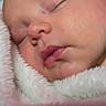 Jackson is registered to the contest to win money with this photo: baby, sleeping, close_up, blanket, soft_texture, face, peaceful, newborn, child, skin, lips, nose, cheek, eyelid, cozy, warm, infant, portrait, cuddly, resting