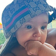Kayden participe au concours pour gagner de l'argent avec cette photo : baby, cap, child, childhood, closeup, cute, daylight, expression, eyes, face, fashion, gucci, hand, hat, infant, mouth, outdoor, person, portrait, skin