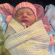 Hallie-Mae is registered to the contest to win money with this photo: baby, baby_clothes, blanket, child, cozy, cute, face, indoors, infant, knitted, newborn, peaceful, pink_hat, portrait, resting, sleep, sleeping, soft_fabric, warm, wrapped