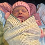 newborn, baby, sleeping, pink_hat, blanket, knitted, wrapped, cozy, soft_fabric, infant, peaceful, cute, portrait, indoors, child, face, sleep, baby_clothes, warm, resting