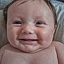 Hudson is registered to the contest to win money with this photo: baby, smiling, face, closeup, child, infant, skin, head, hair, bed, pillow, metal_headboard, cheeks, happy, young, person, indoors, portrait, cute, expression