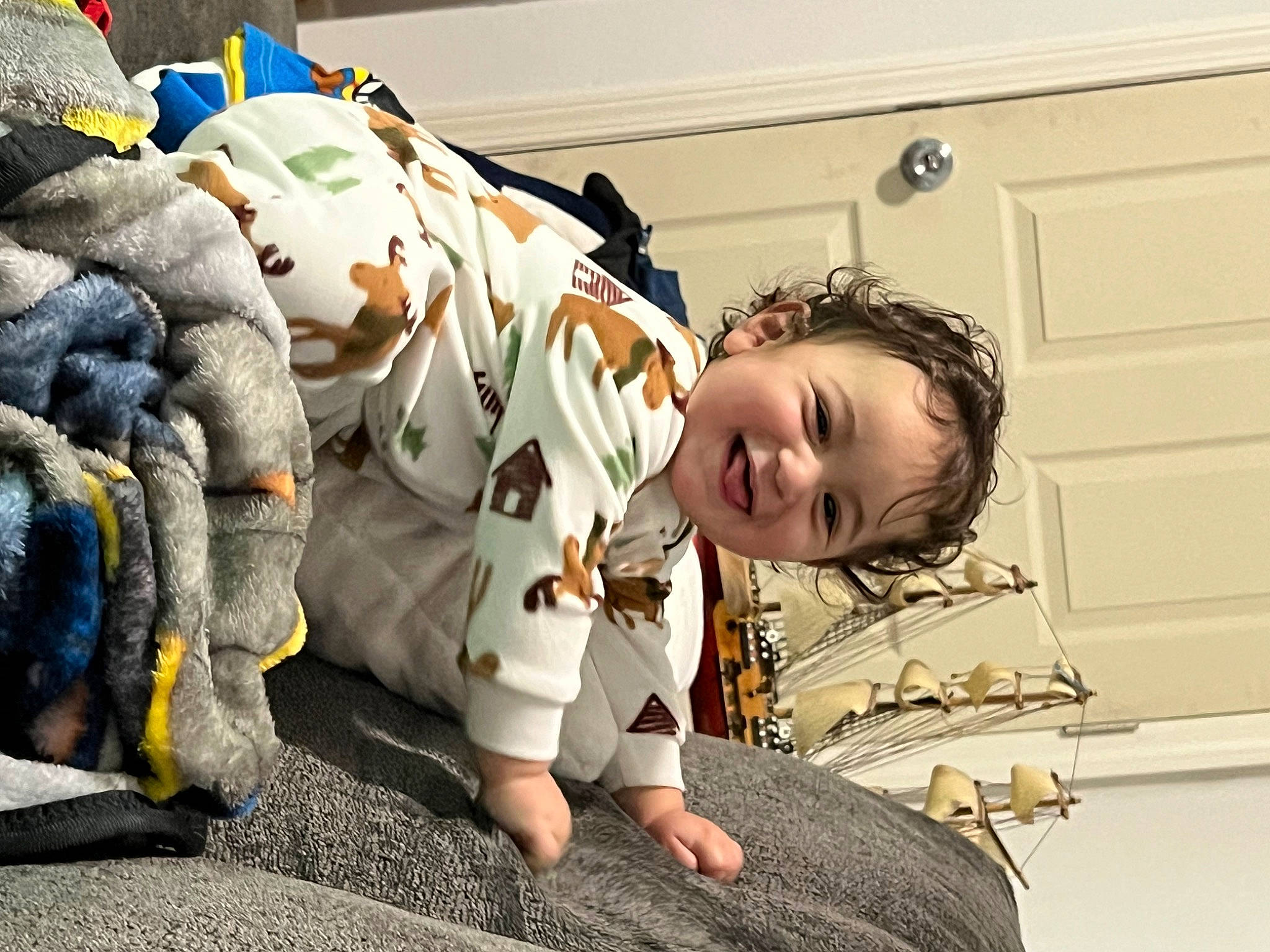 Luka is registered to the contest to win money with this photo: baby, baby_toddler_clothing, child, comfort, flooring, fun, fur, grass, happy, joy, leisure, linens, pattern, person, pumpkin, room, sitting, smile, stuffed_toy, toddler