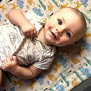 Wilder joined the competition — help win amazing prizes! baby, child, infant, smiling, blanket, animal_print, giraffe, elephant, lion, crocodile, cute, happy, lying_down, clothing, person, portrait, indoors, playpen, soft_texture, toddler