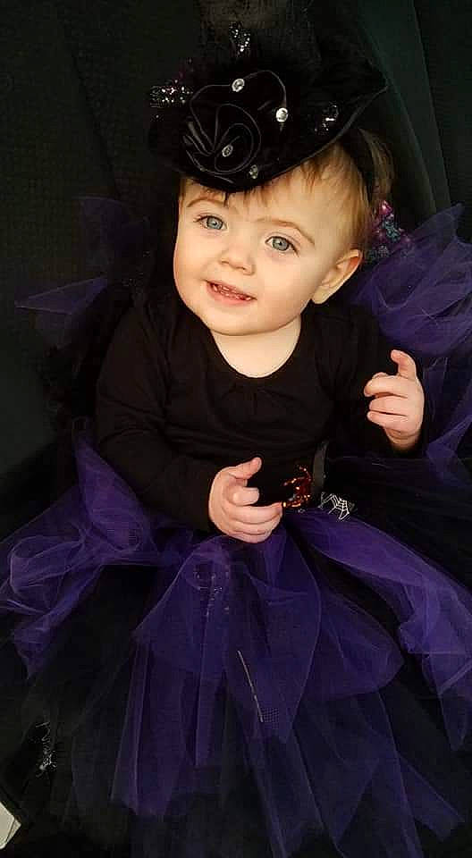 Aleah is registered to the contest to win money with this photo: ballet_tutu, child, child_model, costume, formal_wear, headpiece, person, purple, smile, toddler, violet